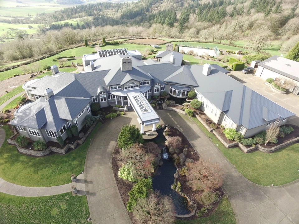 Deep Charcoal Interlock IB Membrane aluminum roof on a Deep Charcoal metal roof on a two-storey home in a, Turner, Oregon