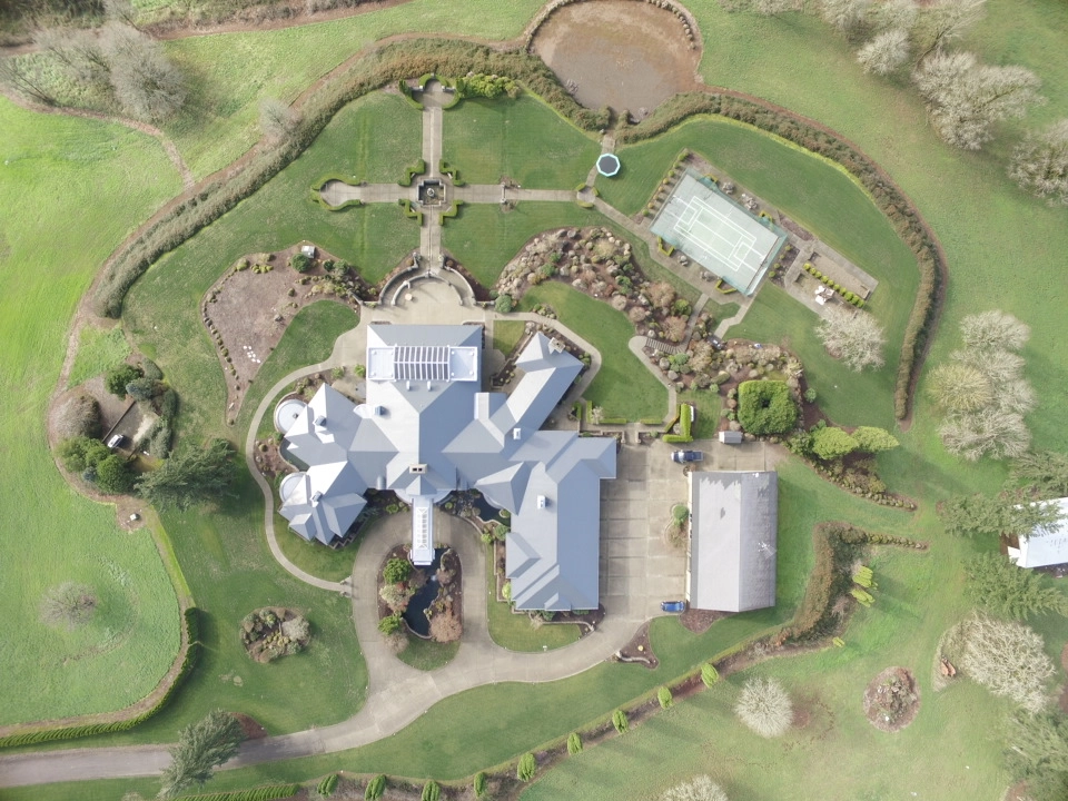 Deep Charcoal Interlock IB Membrane aluminum roof on a single-family home with a metal roof in a rural setting, Turner, Oregon
