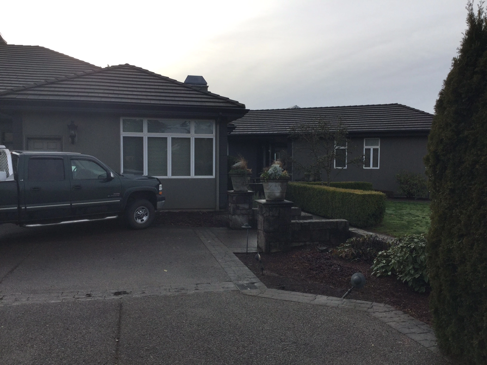 Before: a leaking concrete tile roof on the home, Turner, Oregon, ahead of a Deep Charcoal Interlock IB Membrane aluminum roof