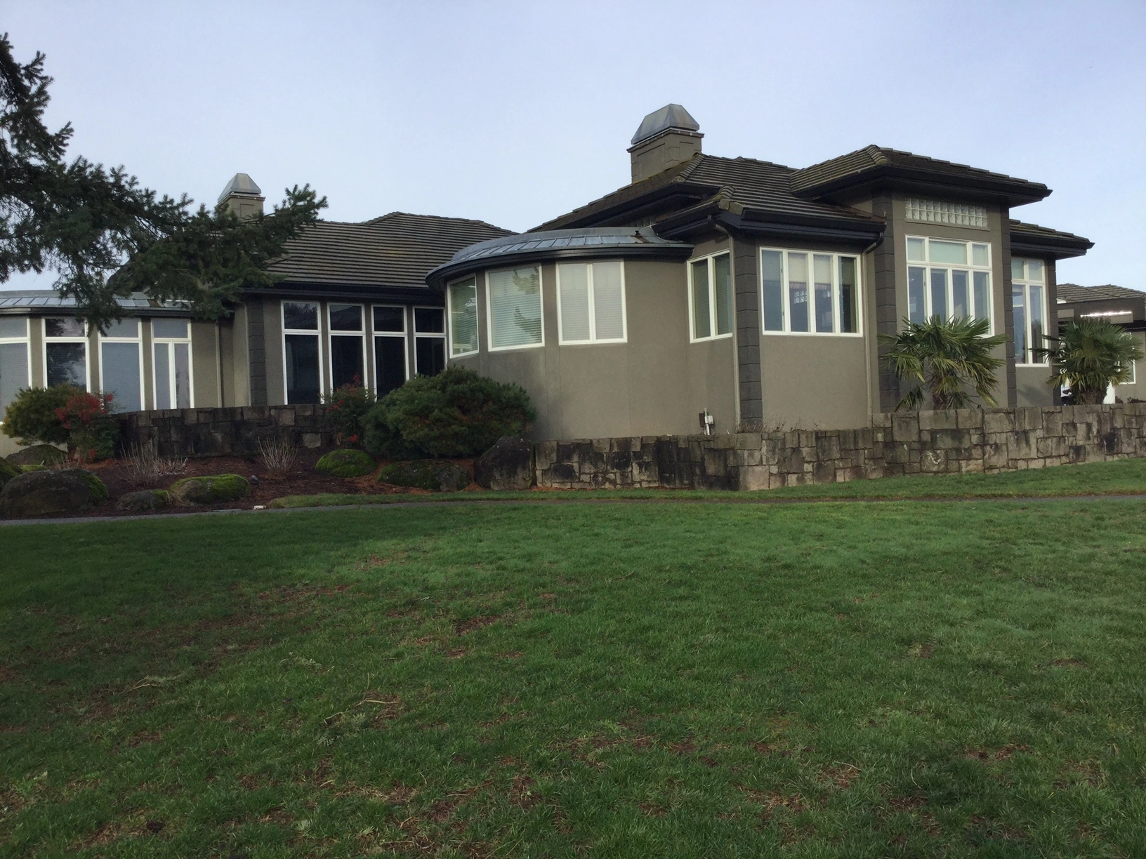 Before: a leaking concrete tile roof on the home, Turner, Oregon, ahead of a Deep Charcoal Interlock IB Membrane aluminum roof