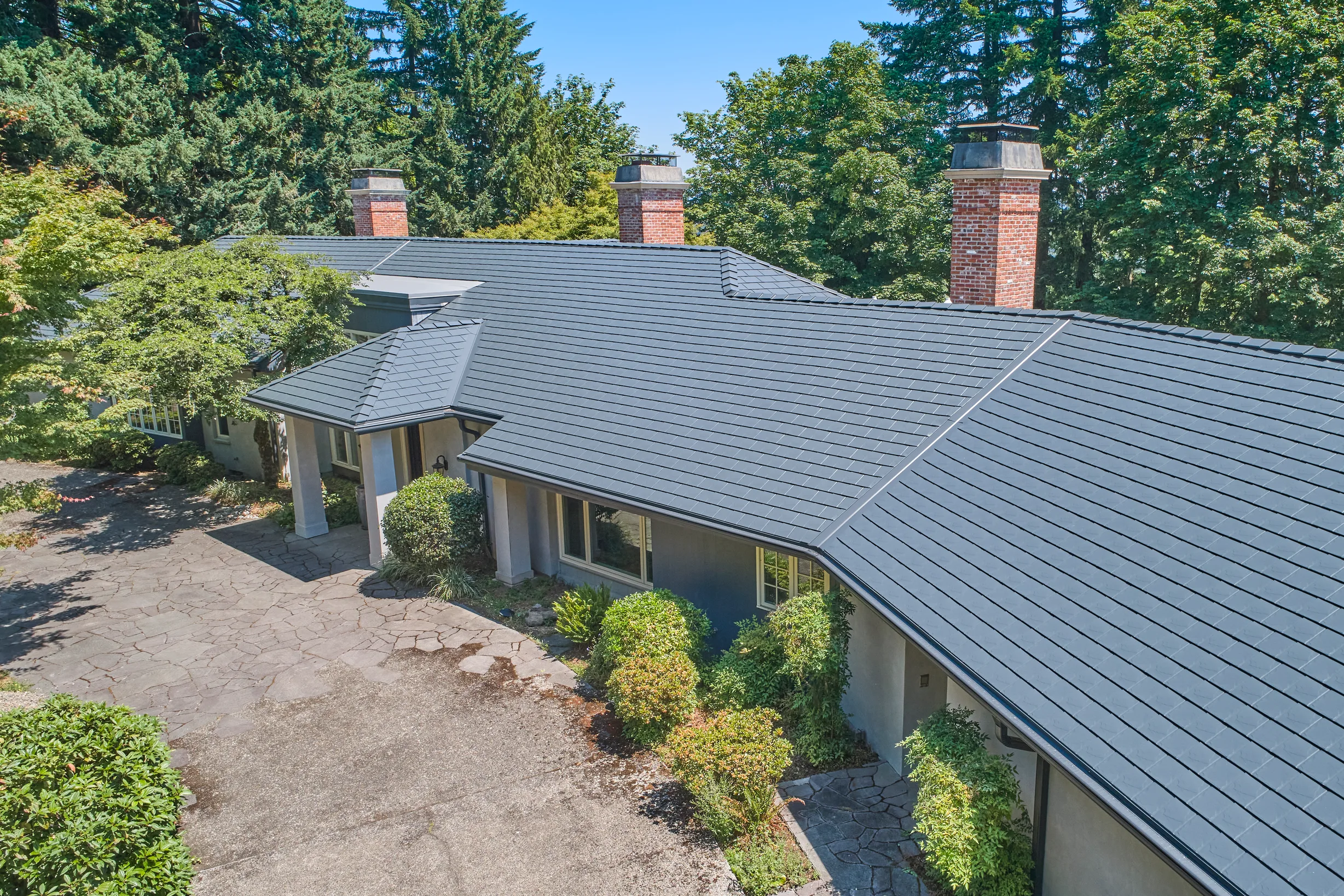 Deep Charcoal Interlock Slate aluminum roof on a Deep Charcoal metal roof on a ranch style home in a, Portland, Oregon