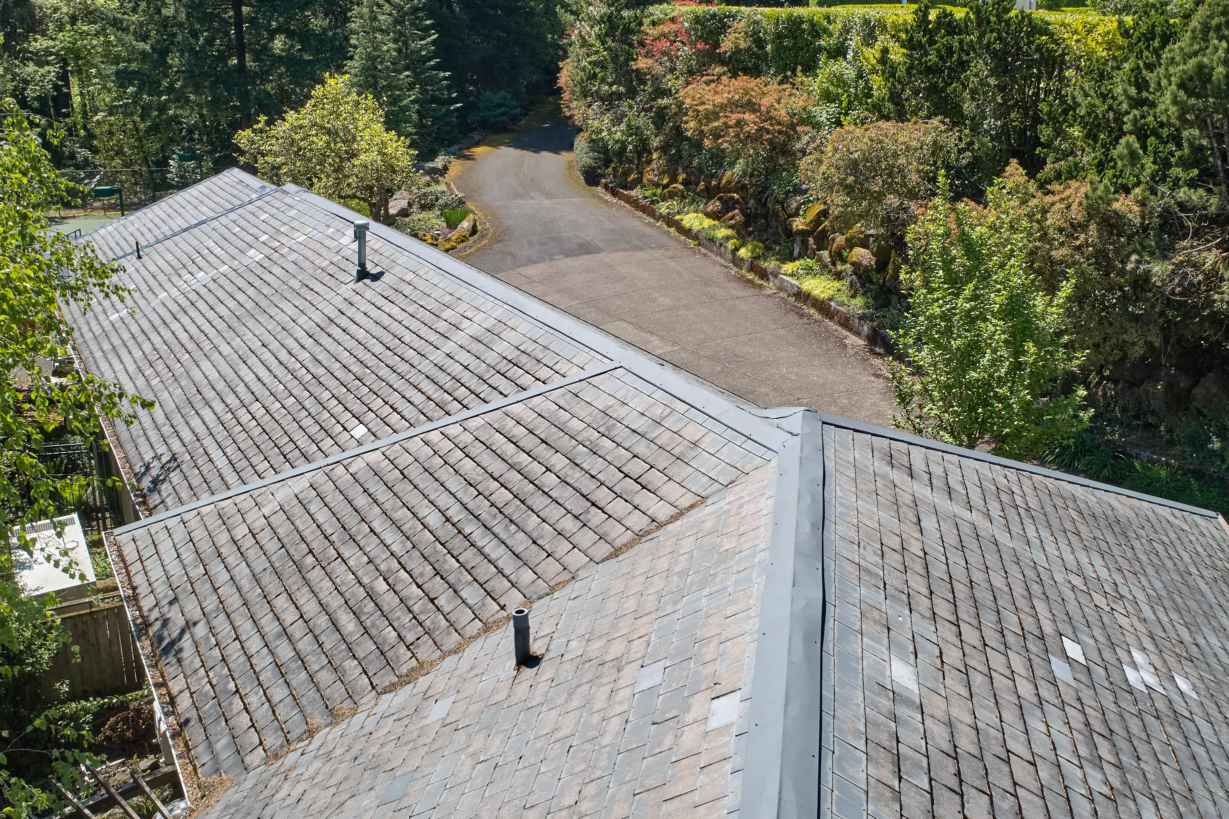 Before: a leaking natural slate roof on the home, Portland, Oregon, ahead of a Deep Charcoal Interlock Slate aluminum roof