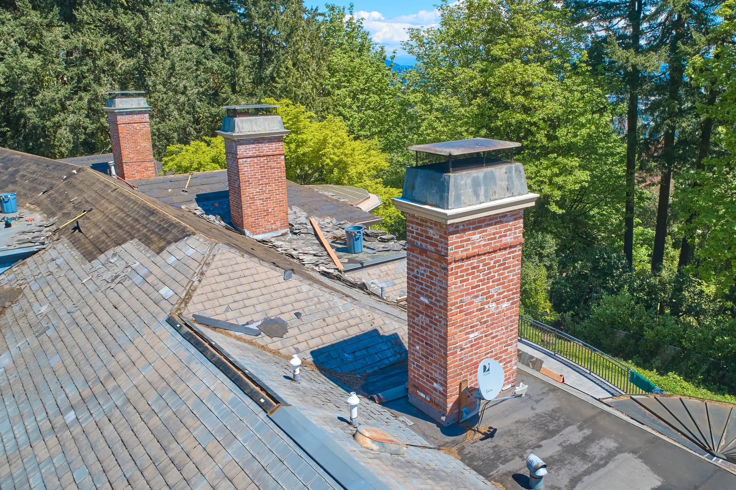 Before: a leaking natural slate roof on the home, Portland, Oregon, ahead of a Deep Charcoal Interlock Slate aluminum roof
