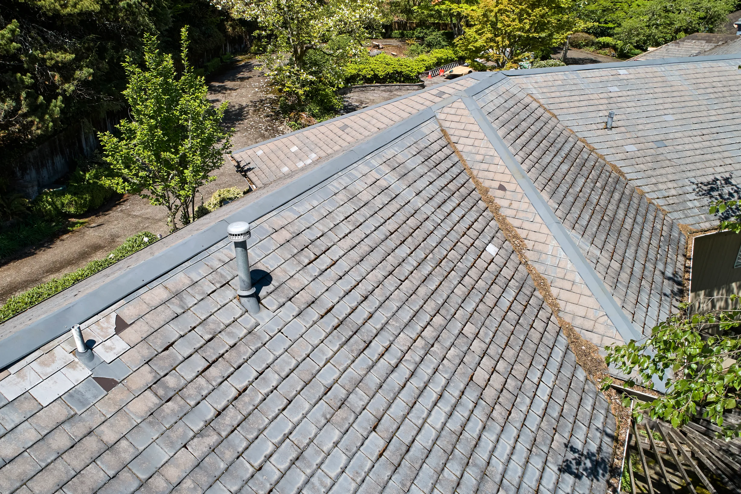 Before: a leaking natural slate roof on the home, Portland, Oregon, ahead of a Deep Charcoal Interlock Slate aluminum roof