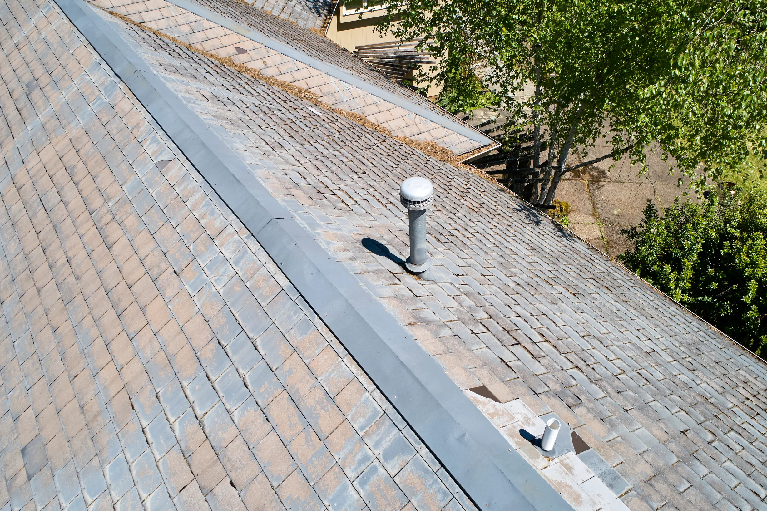 Before: a leaking natural slate roof on the home, Portland, Oregon, ahead of a Deep Charcoal Interlock Slate aluminum roof