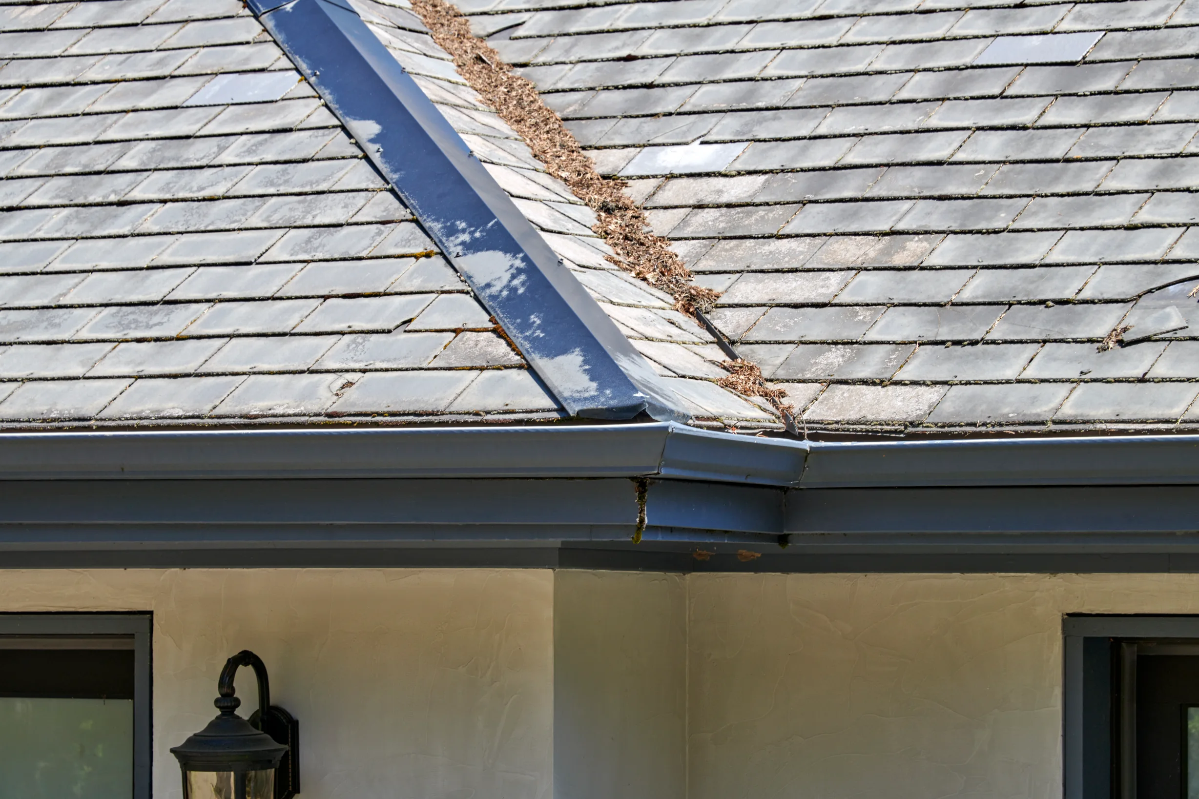 Before: a natural slate roof on the home, Portland, Oregon, ahead of a Deep Charcoal Interlock Slate aluminum roof