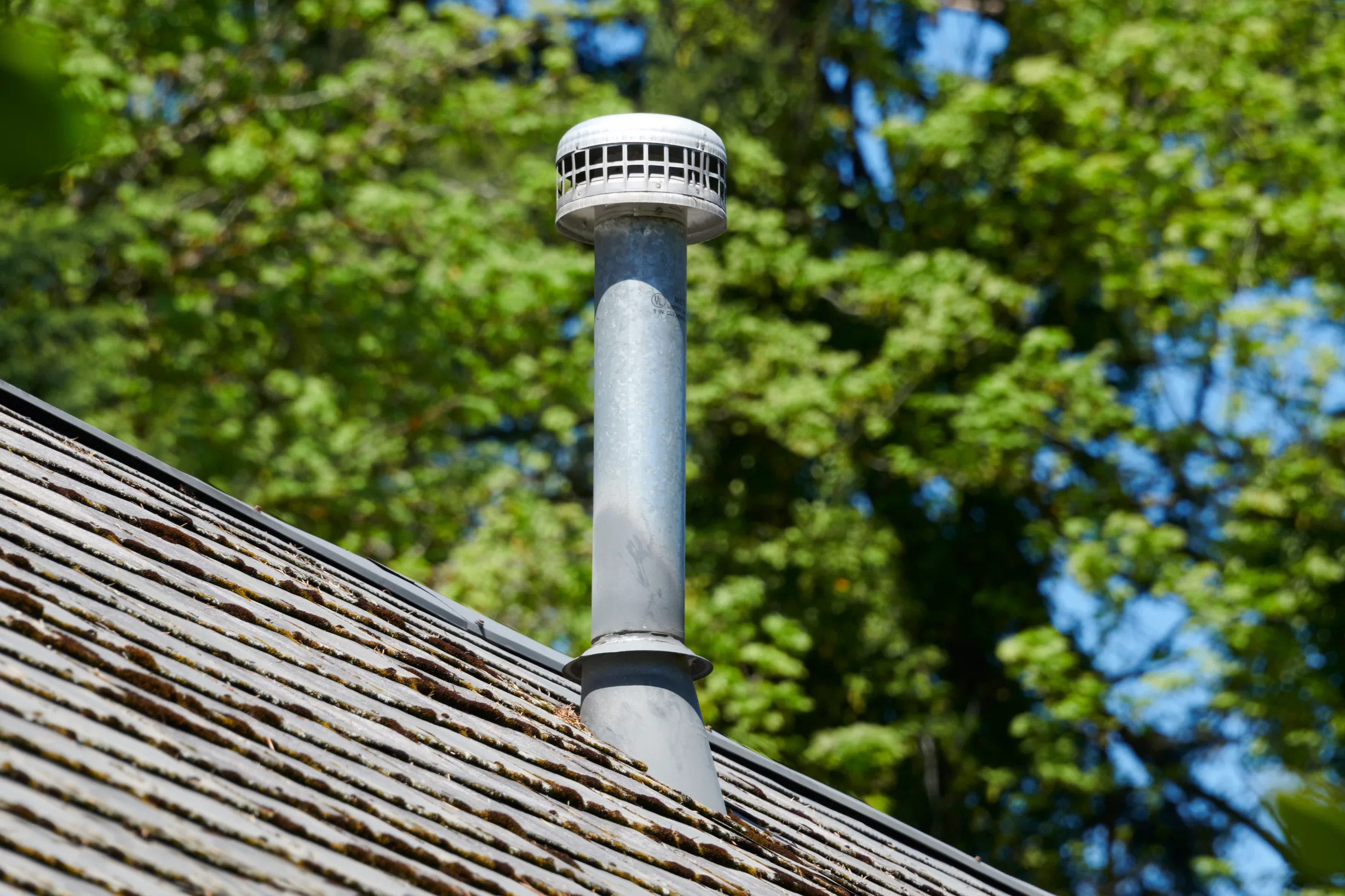 Before: the old roof on a Deep Charcoal Interlock Slate roof on a single-family, Portland, Oregon, ahead of a Deep Charcoal Interlock Slate aluminum roof