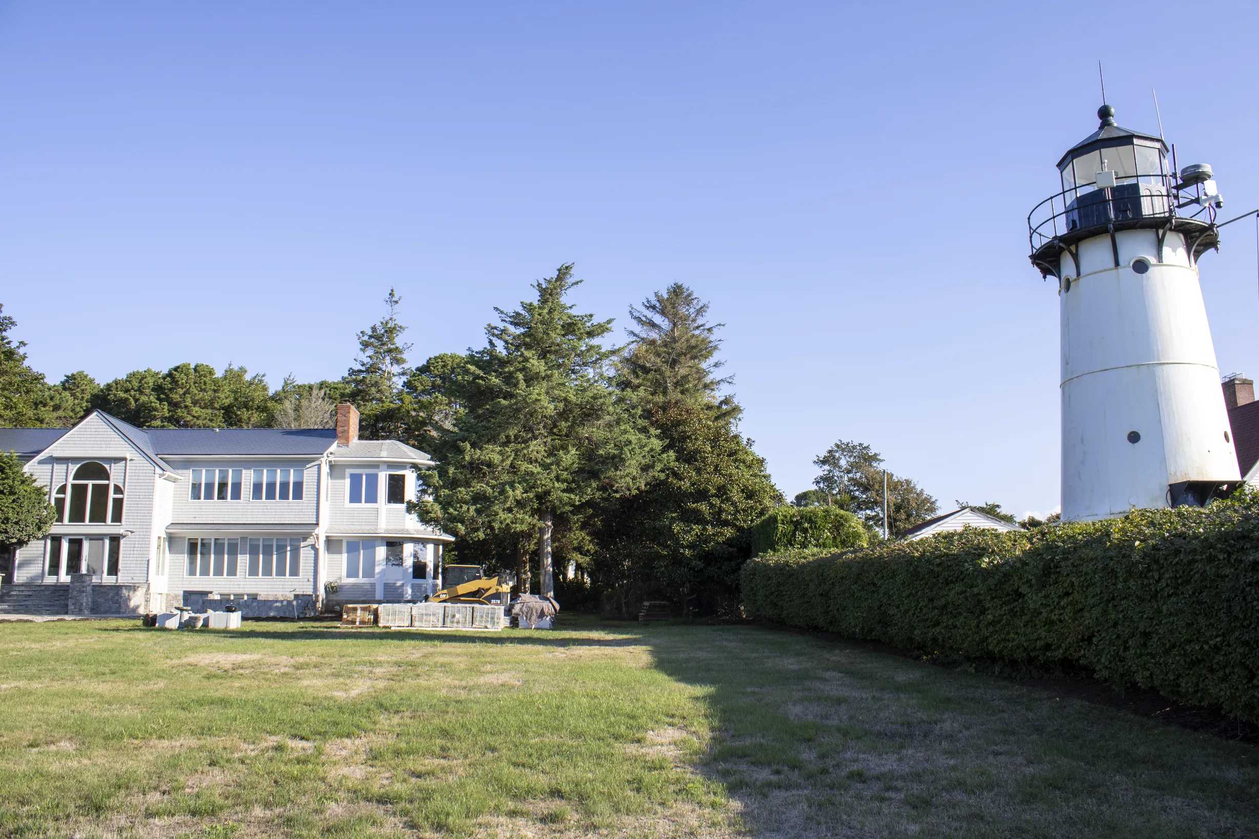 Deep Charcoal Interlock Slate aluminum roof on a white colonial home with a deep charcoal metal roof in a, Warwick, Rhode Island
