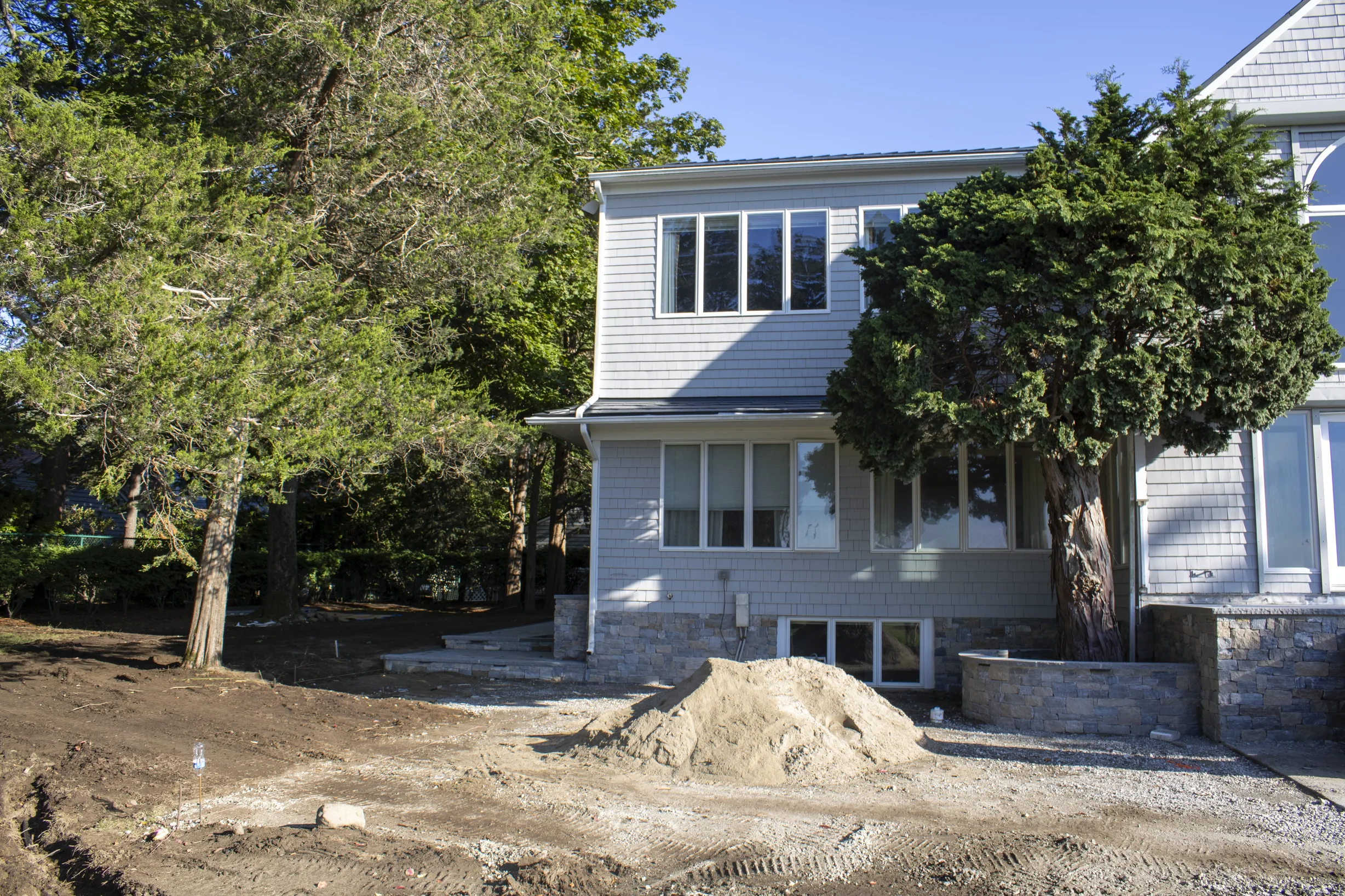 Deep Charcoal Interlock Slate aluminum roof on a white two-storey Colonial with a slate metal roof in a, Warwick, Rhode Island