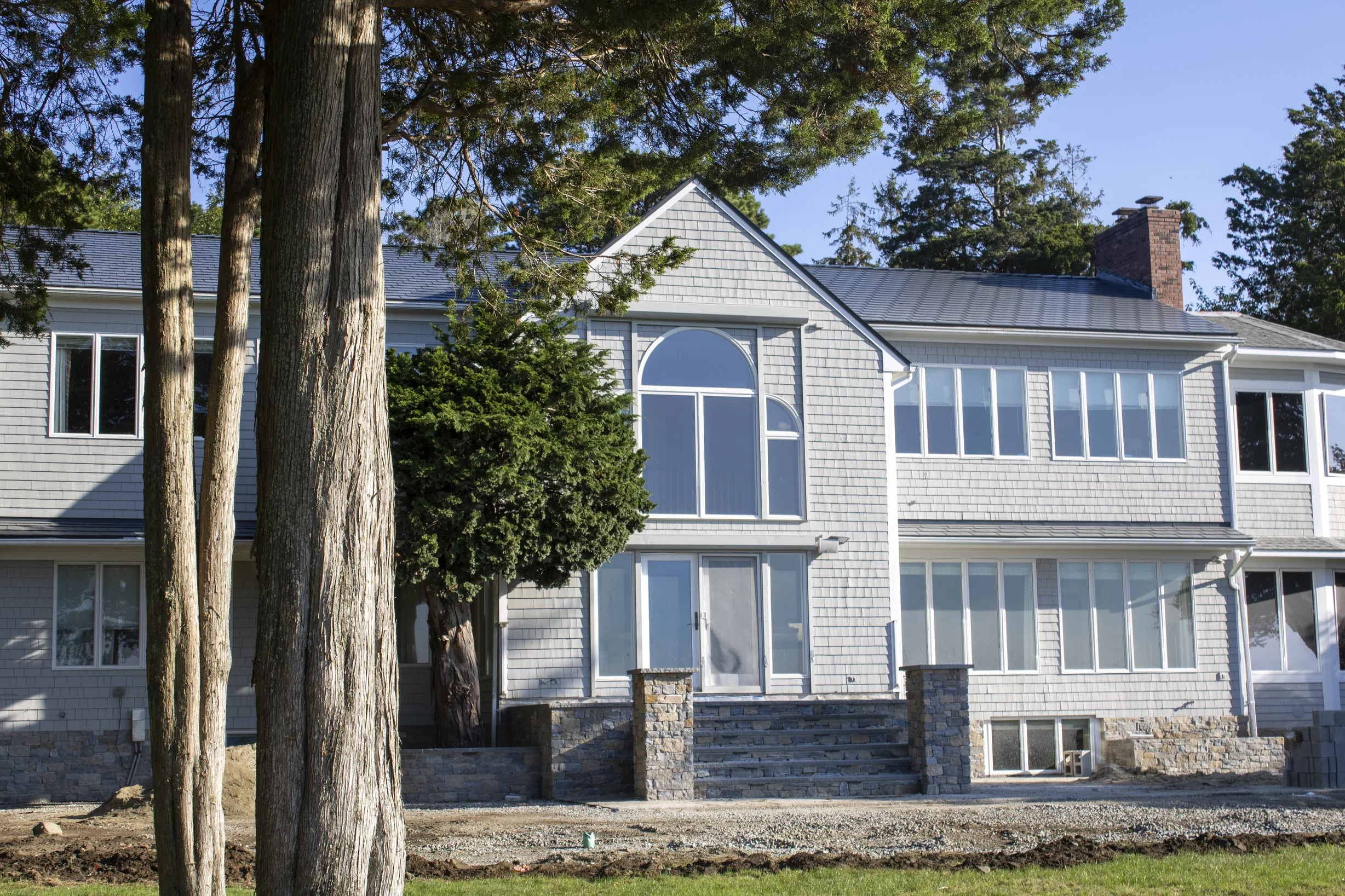 Deep Charcoal Interlock Slate aluminum roof on a Deep Charcoal Interlock Slate metal roof on a two-storey, Warwick, Rhode Island