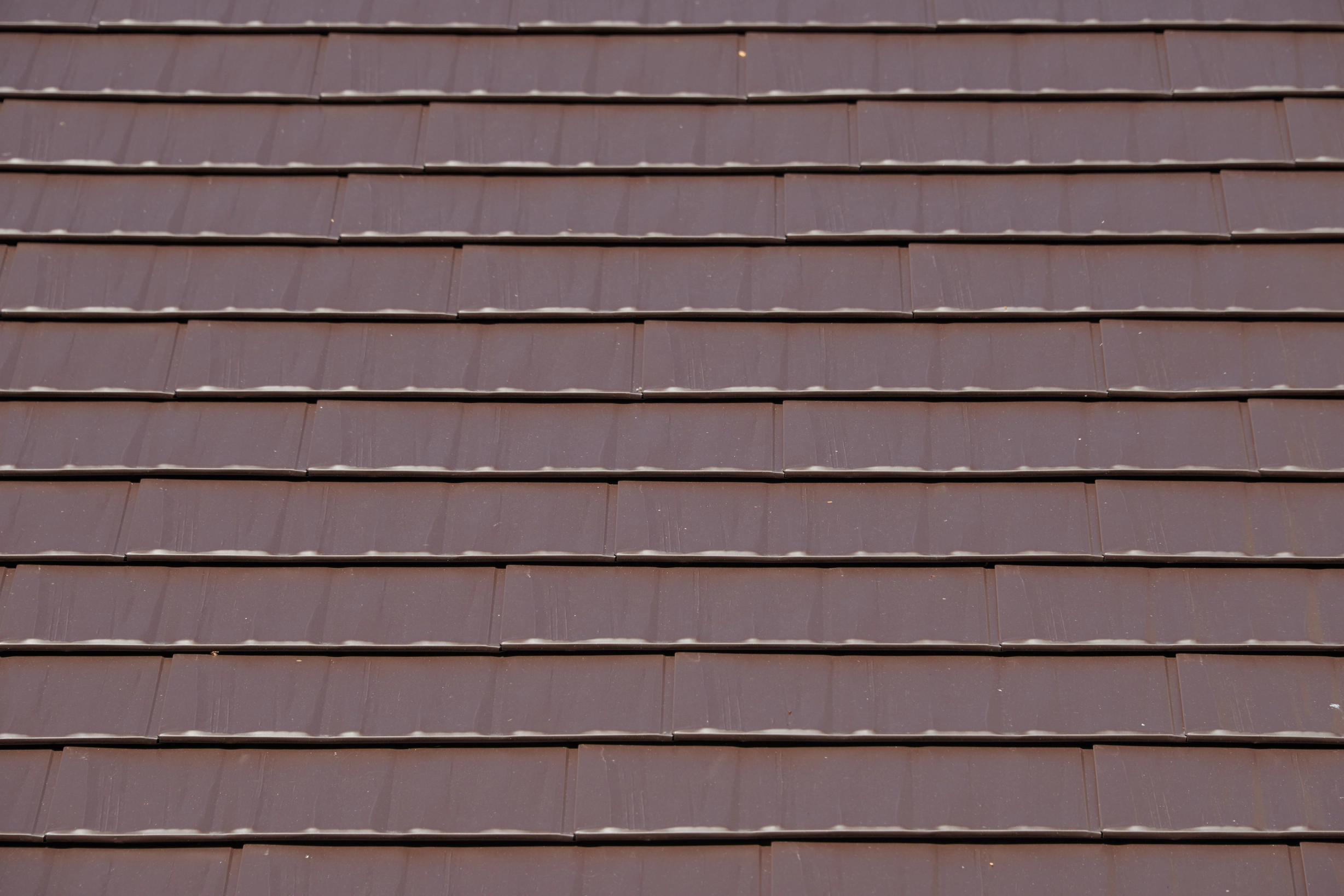 Colonial Brown Interlock Cedar Shingle aluminum roof on a Colonial brown metal roof on a single-family home in, Shoreline, Washington