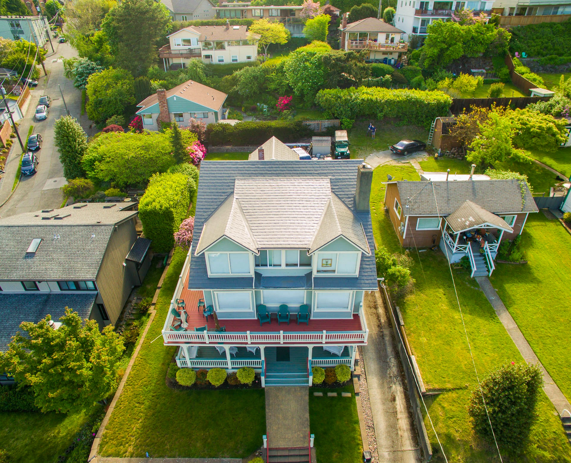 Musket Grey Interlock Slate aluminum roof on a two-storey craftsman home with a grey metal roof in a, Seattle, Washington