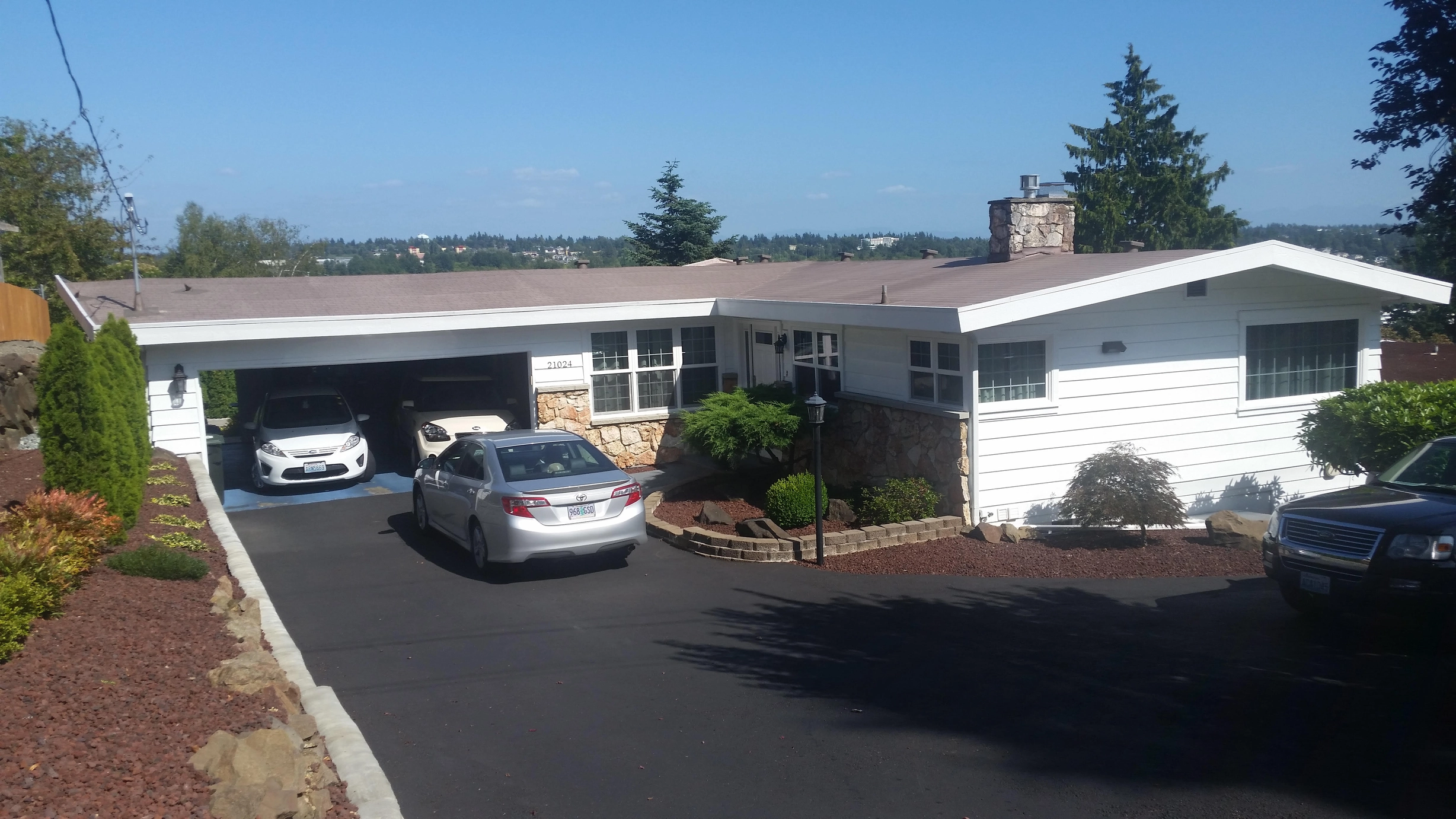 Before: the old roof on the home, Des Moines, Washington, ahead of a Black Interlock Standing Seam aluminum roof