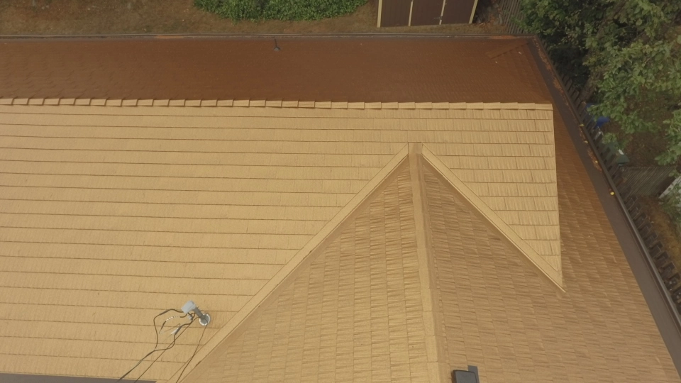 Aged Copper Interlock Cedar Shingle aluminum roof on a two-storey home with dormers in a suburban neighbourhood, Bellevue, Washington