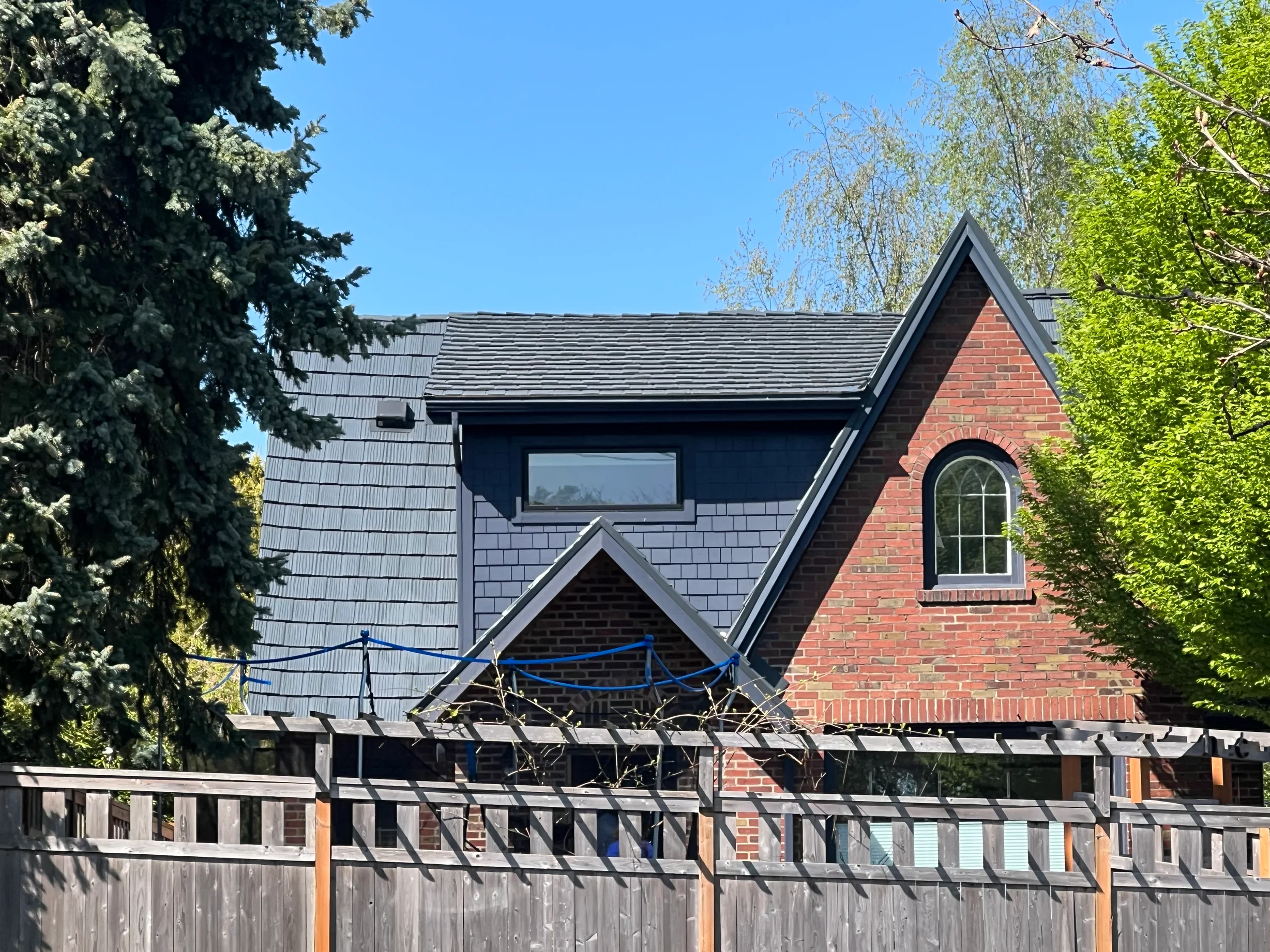 Deep Charcoal Interlock Shake aluminum roof on a Deep Charcoal metal roof on a two-storey craftsman home, Seattle, Washington