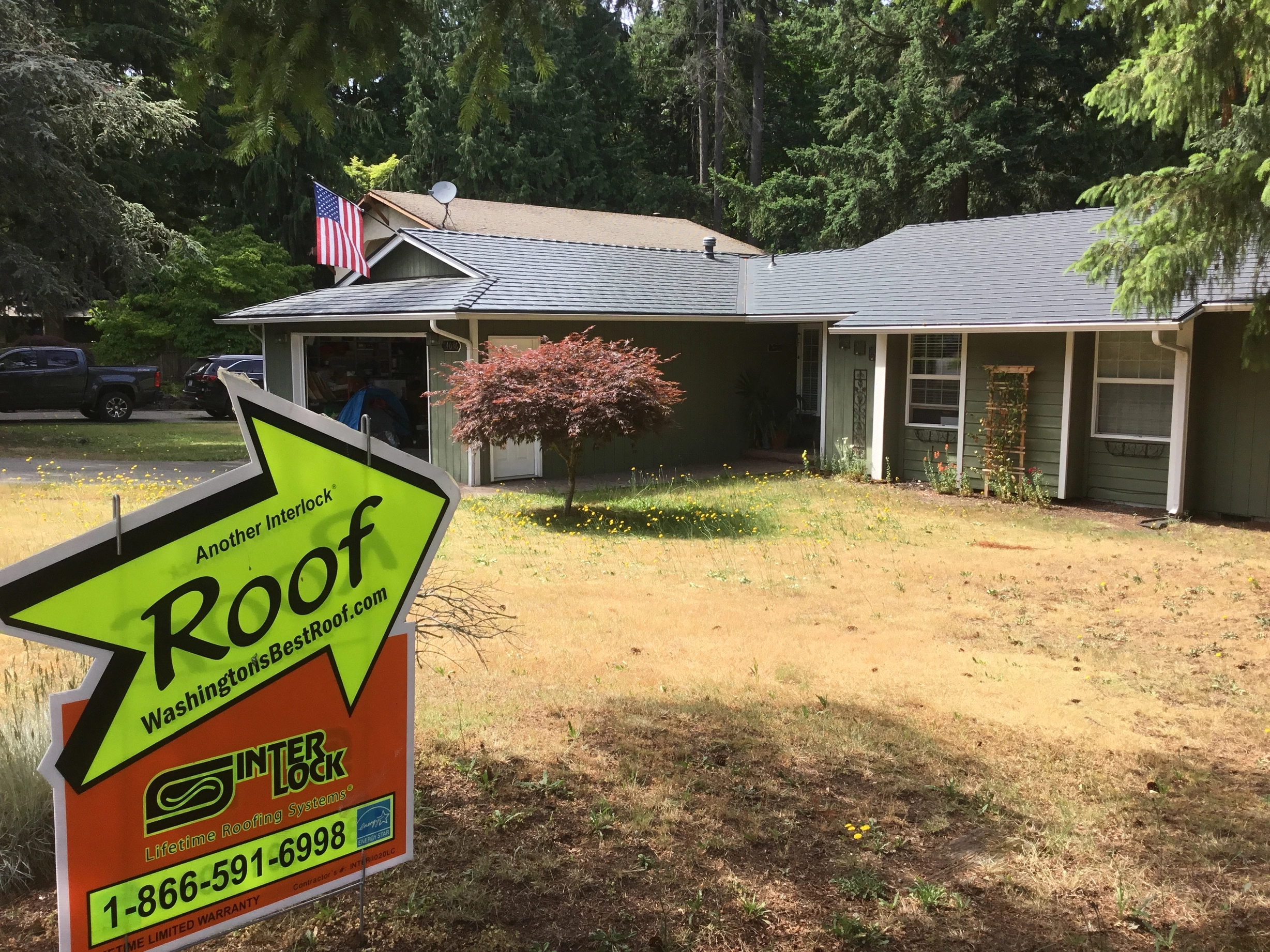 Deep Charcoal Interlock Slate aluminum roof on a Deep Charcoal metal roof on a single-storey home in a, Renton, Washington