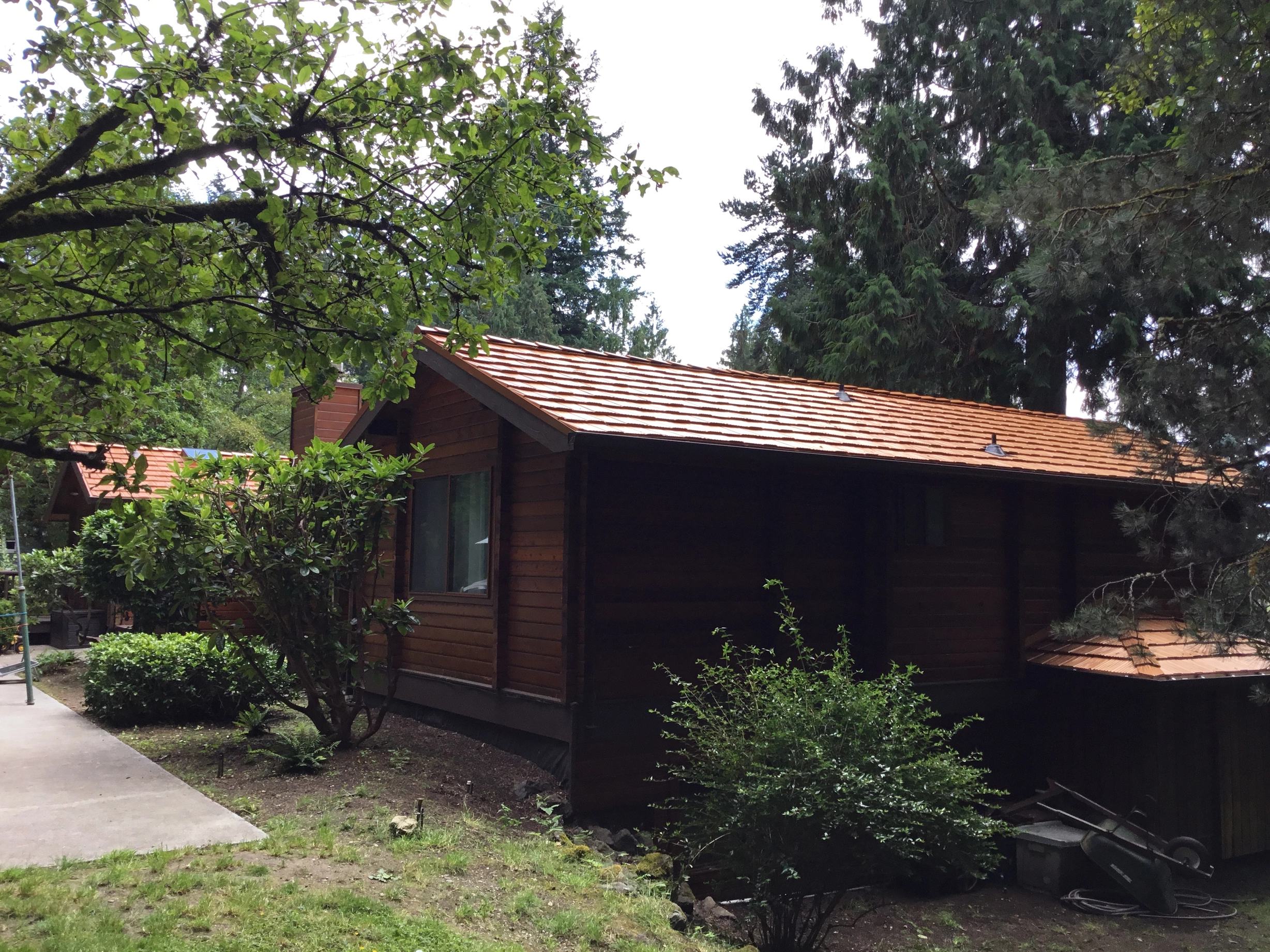 Copper Penny Interlock Shake aluminum roof on a brown single-family home with a copper penny metal roof, Bainbridge Island, Washington