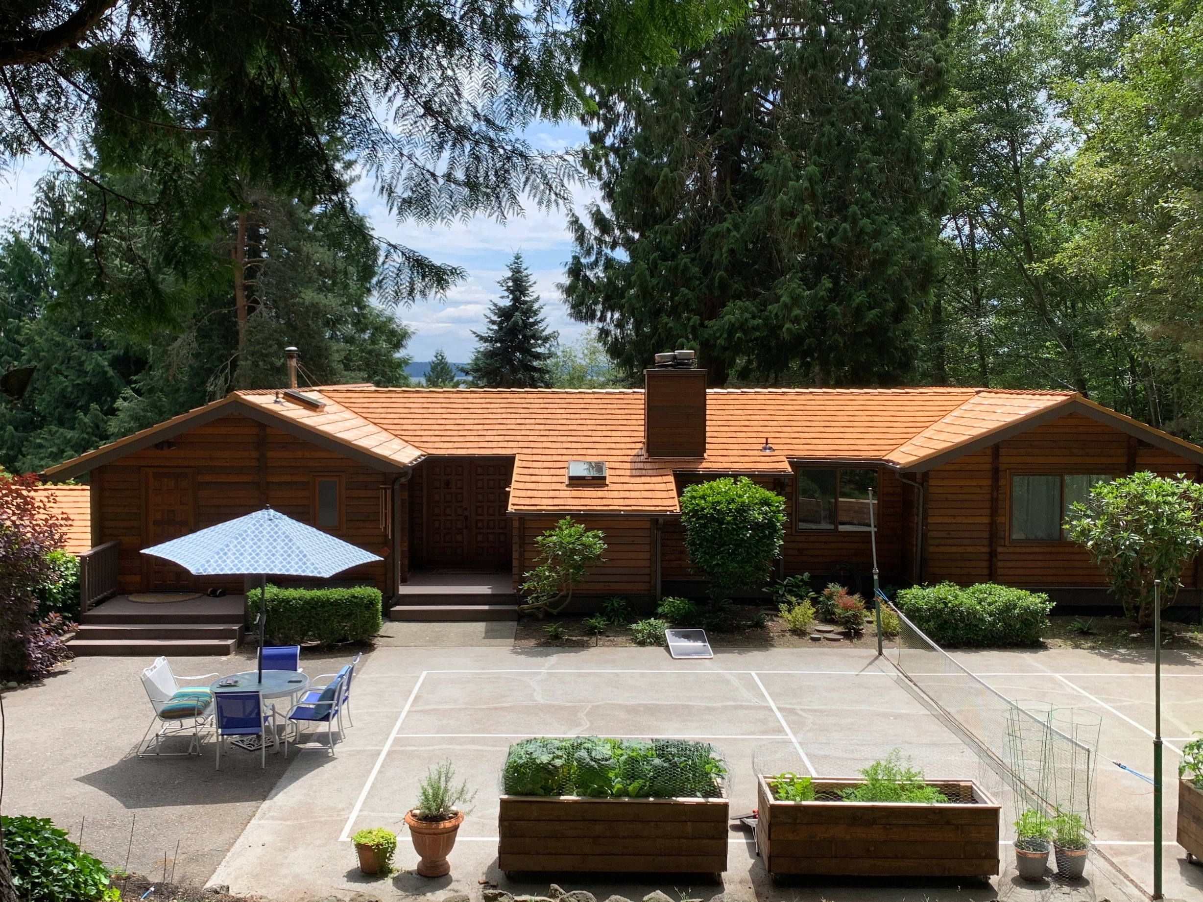 Copper Penny Interlock Shake aluminum roof on a brown ranch style home with a copper penny metal roof in, Bainbridge Island, Washington