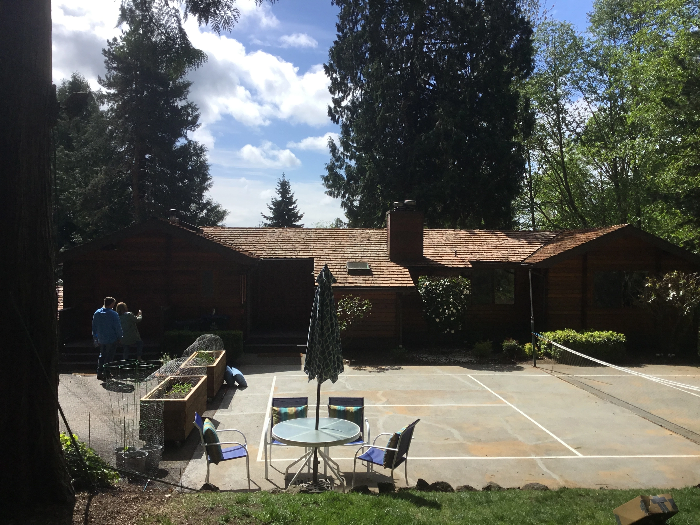Before: a worn out wood shake roof on the home, Bainbridge Island, Washington, ahead of a Copper Penny Interlock Shake aluminum roof