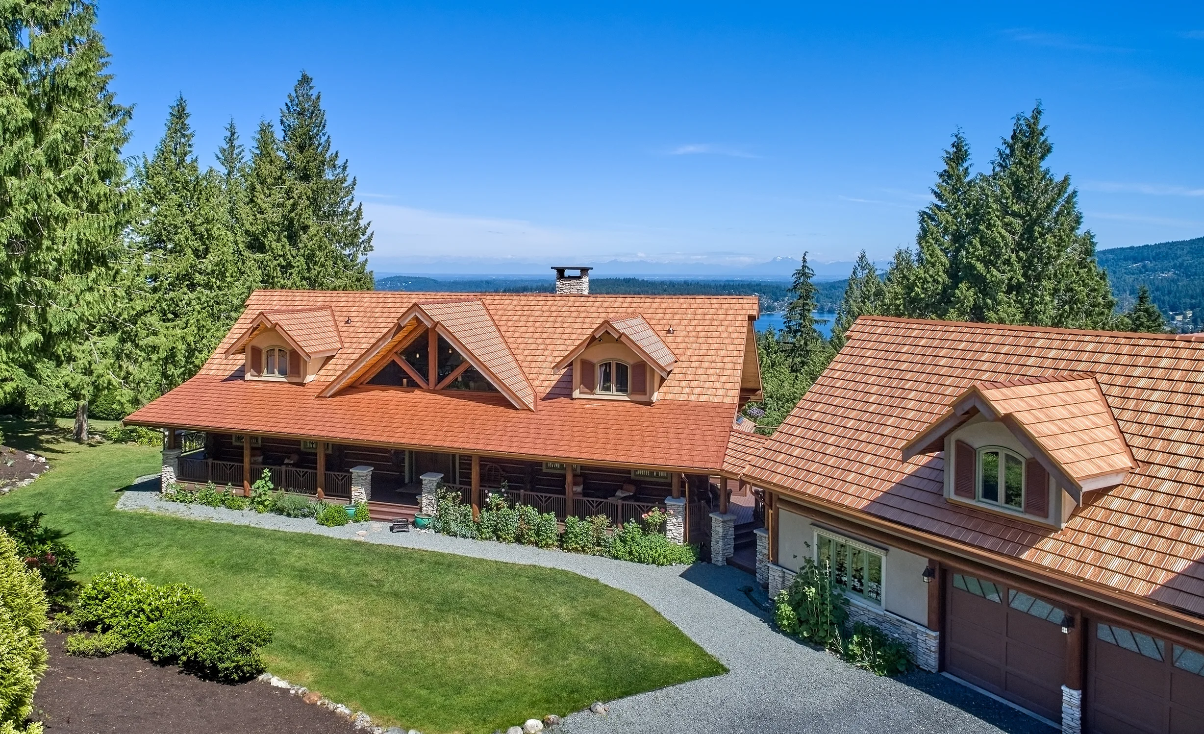 Copper Penny Interlock Shake aluminum roof on a two-storey chalet with a copper penny metal roof in the, Bellingham, Washington