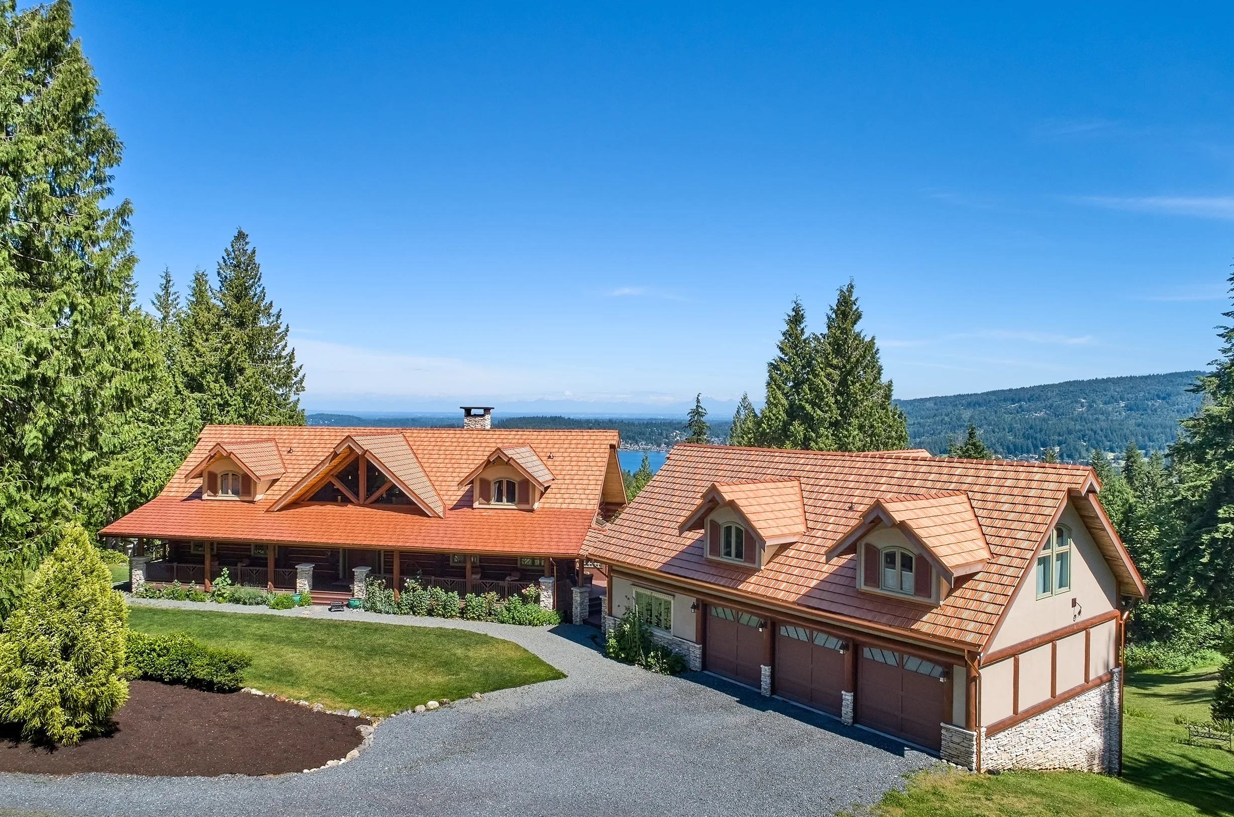 Copper Penny Interlock Shake aluminum roof on a large two-storey chalet with copper penny metal roof in a, Bellingham, Washington