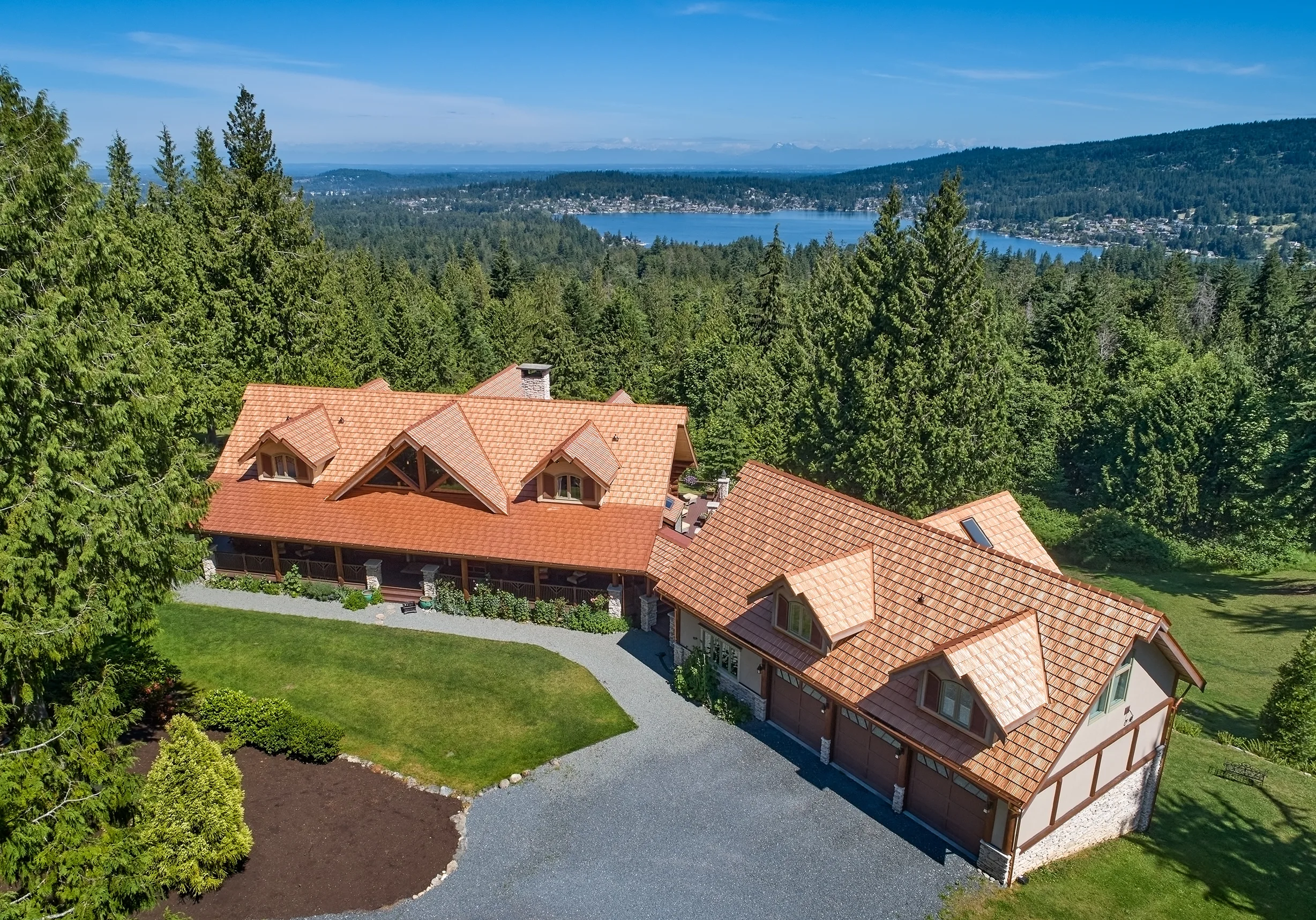 Copper Penny Interlock Shake aluminum roof on a modern home with copper penny metal roof in a forested, Bellingham, Washington