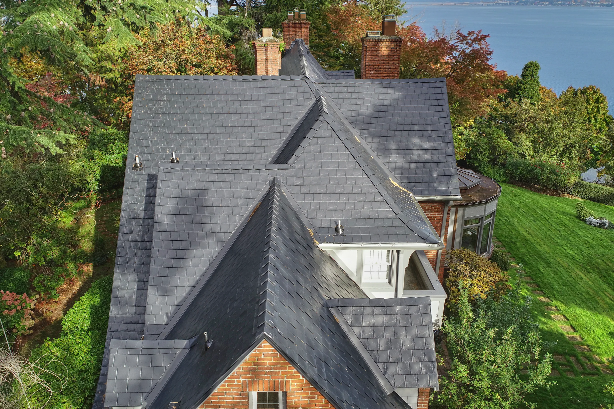 Black Interlock Slate aluminum roof on a black two-storey modern home with dormers by the, Seattle, Washington