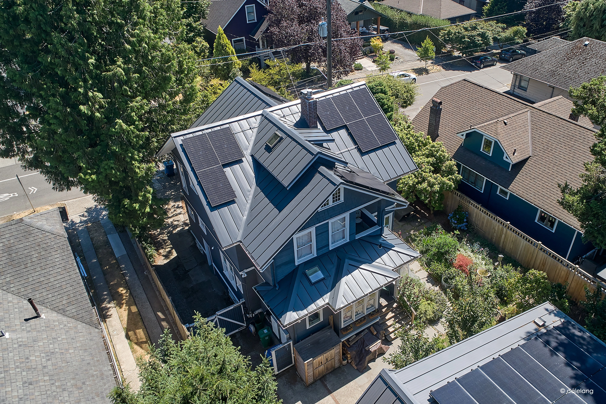 Deep Charcoal Interlock Standing Seam aluminum roof on a deep charcoal metal roof on a two-storey craftsman home, Seattle, Washington