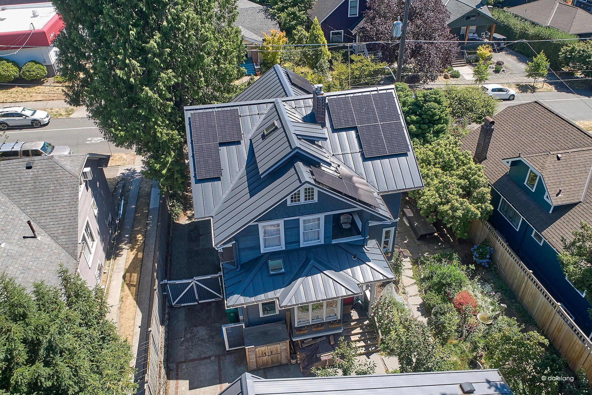 Deep Charcoal Interlock Standing Seam aluminum roof on a Deep Charcoal metal roof on a two-storey craftsman home, Seattle, Washington