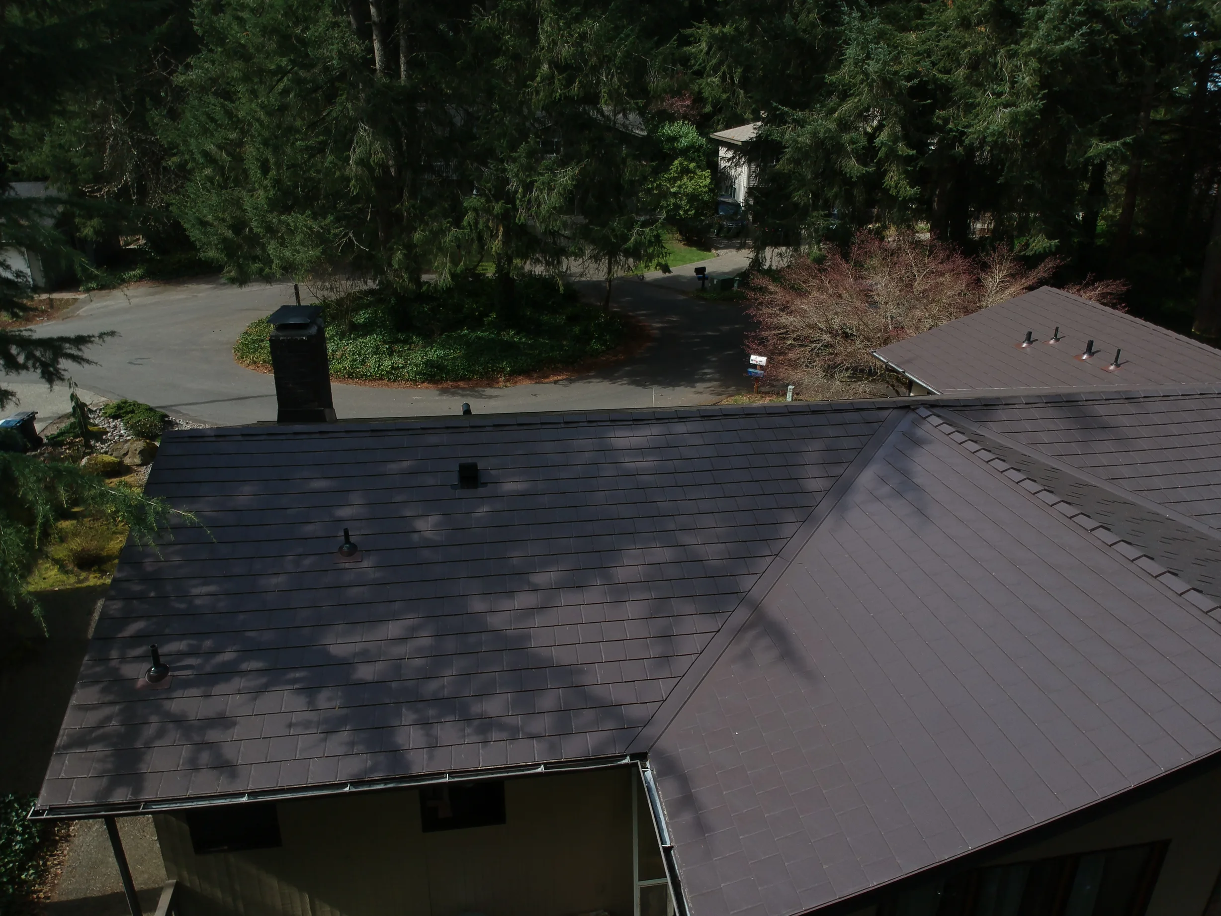 Tudor Brown Interlock Slate aluminum roof on a Tudor Brown metal roof on a ranch house in an urban, University Place, Washington