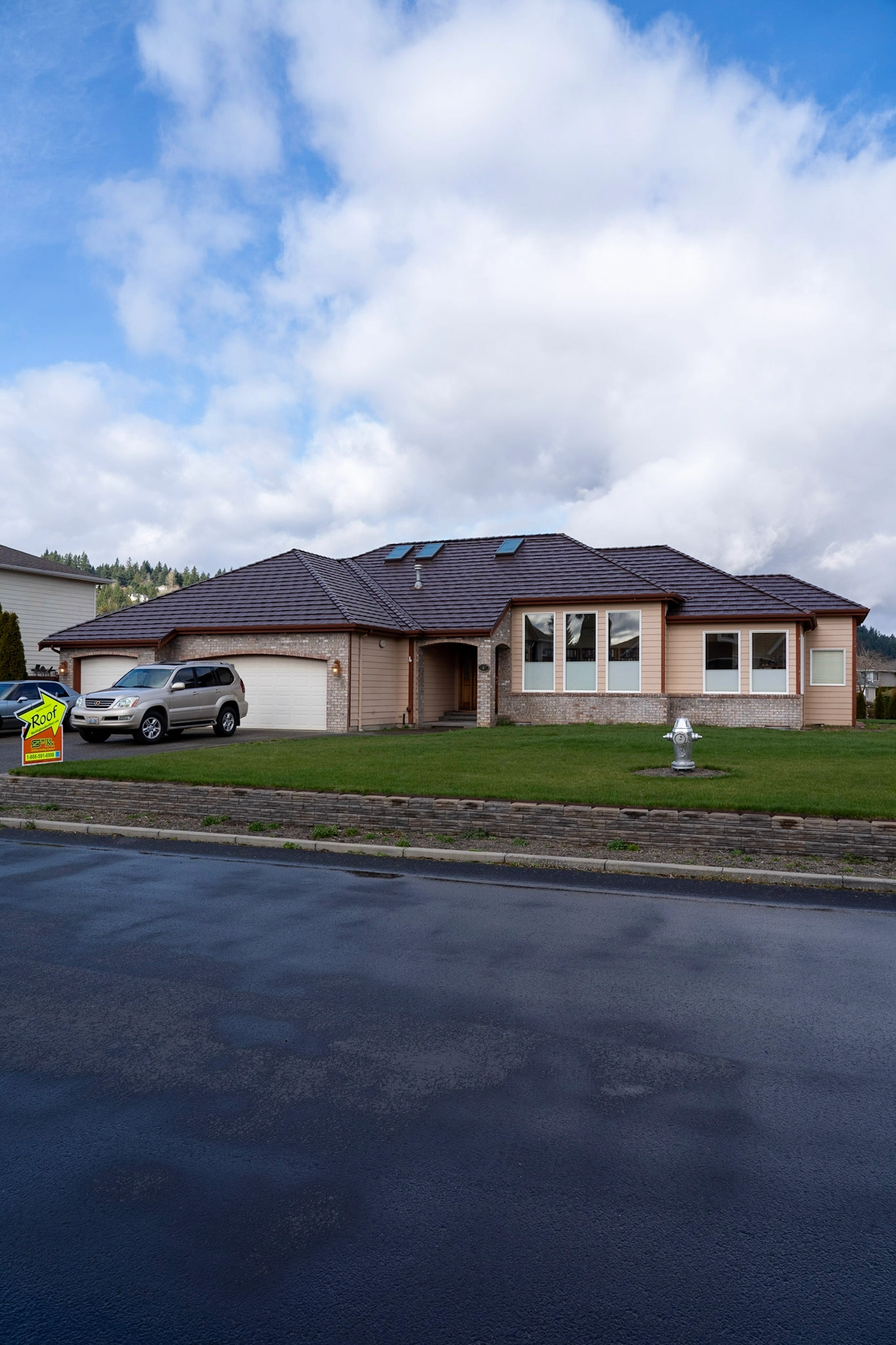 Colonial Brown Interlock Shake aluminum roof on a colonial home with a brown roof in a forested suburban, Orting, Washington