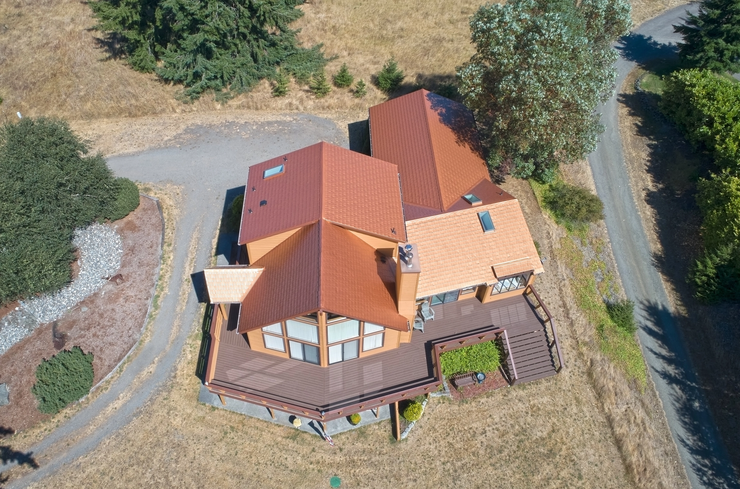 Copper Penny Interlock Cedar Shingle aluminum roof on a copper penny metal roof on a modern single-family home in, Sequim, Washington
