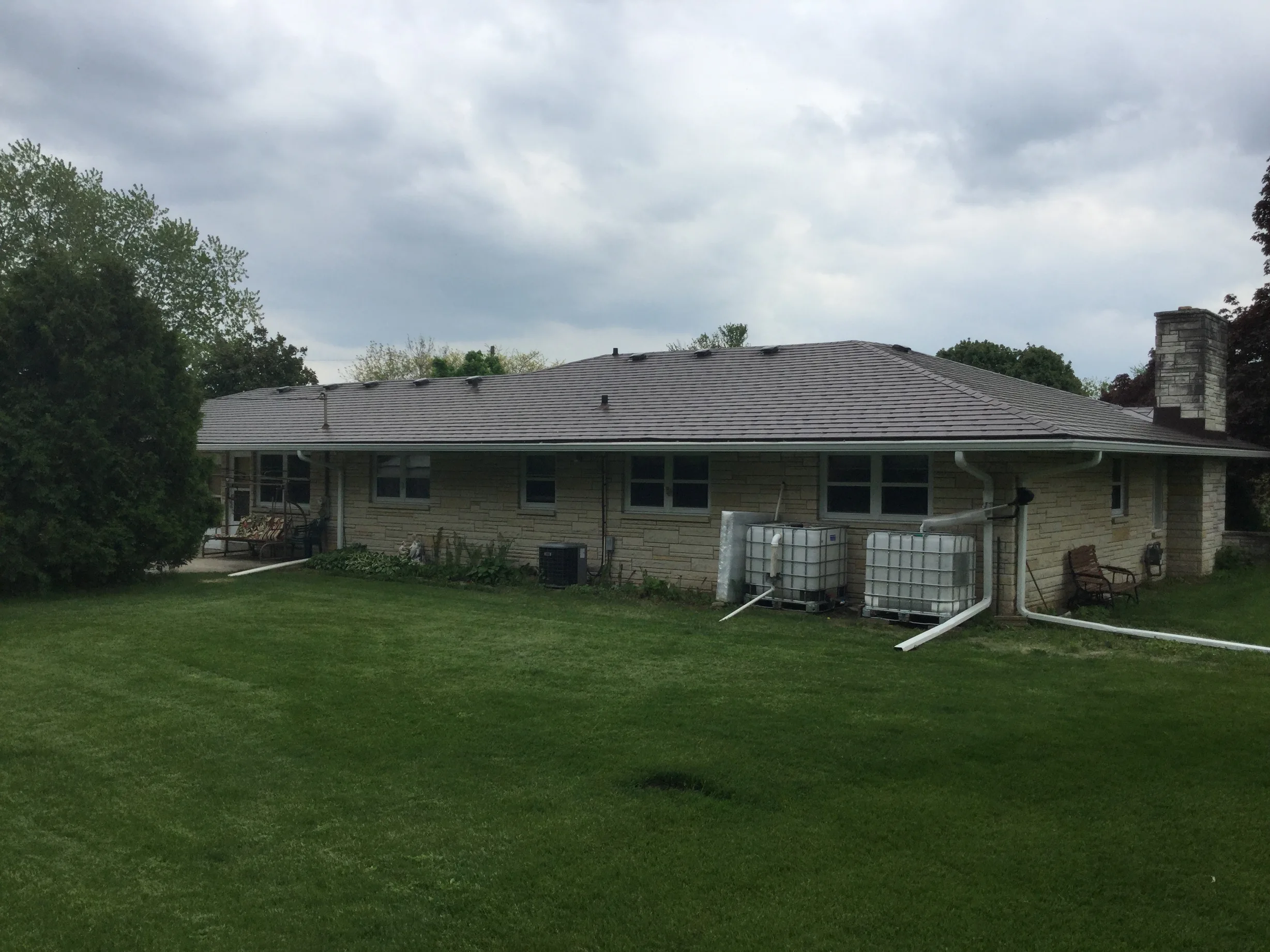 Colonial Brown Interlock Slate aluminum roof on a Colonial home with a Colonial Brown metal roof in a rural, Kewaskum, Wisconsin