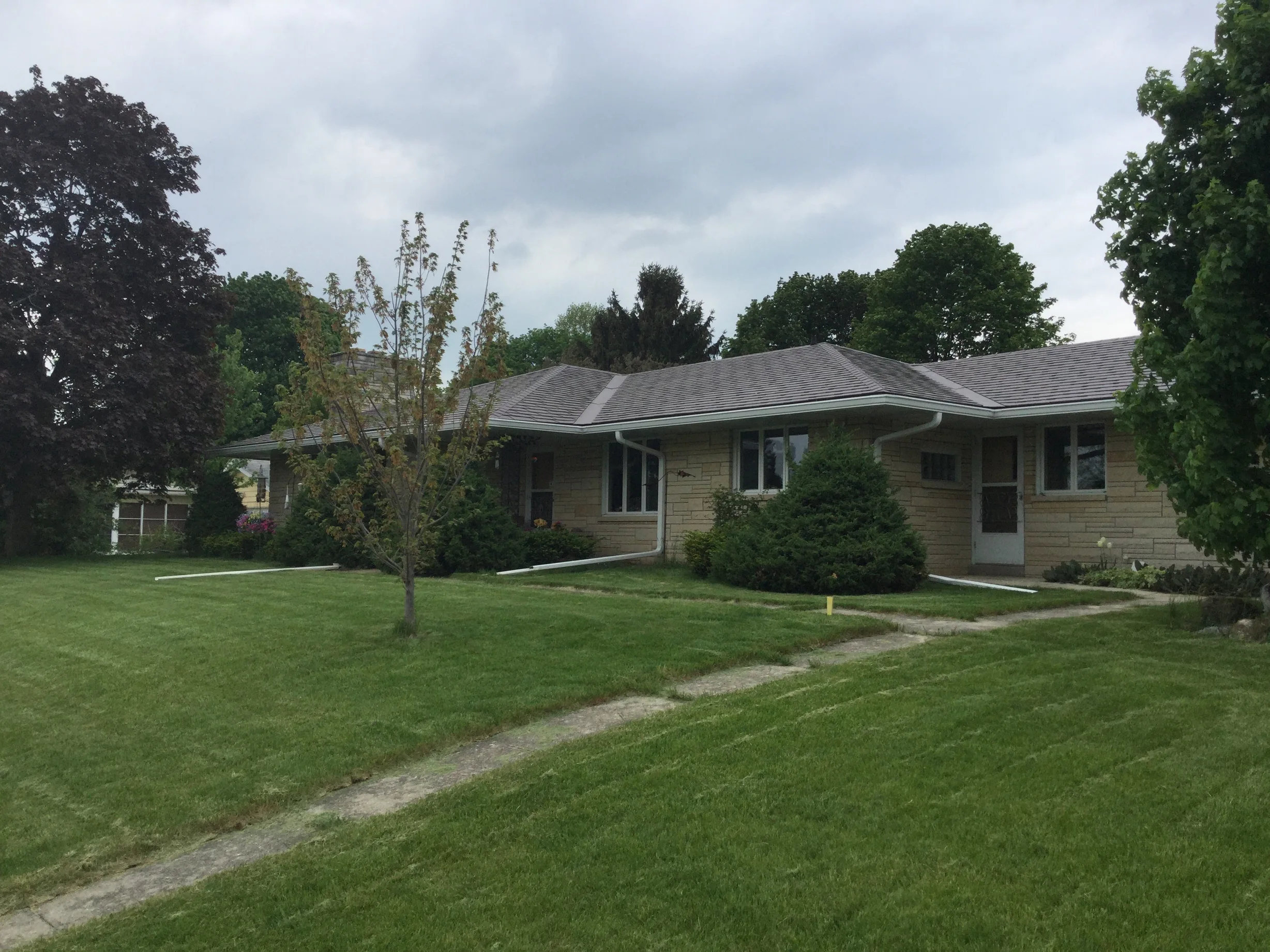 Colonial Brown Interlock Slate aluminum roof on a colonial home with a colonial brown metal roof in a rural, Kewaskum, Wisconsin