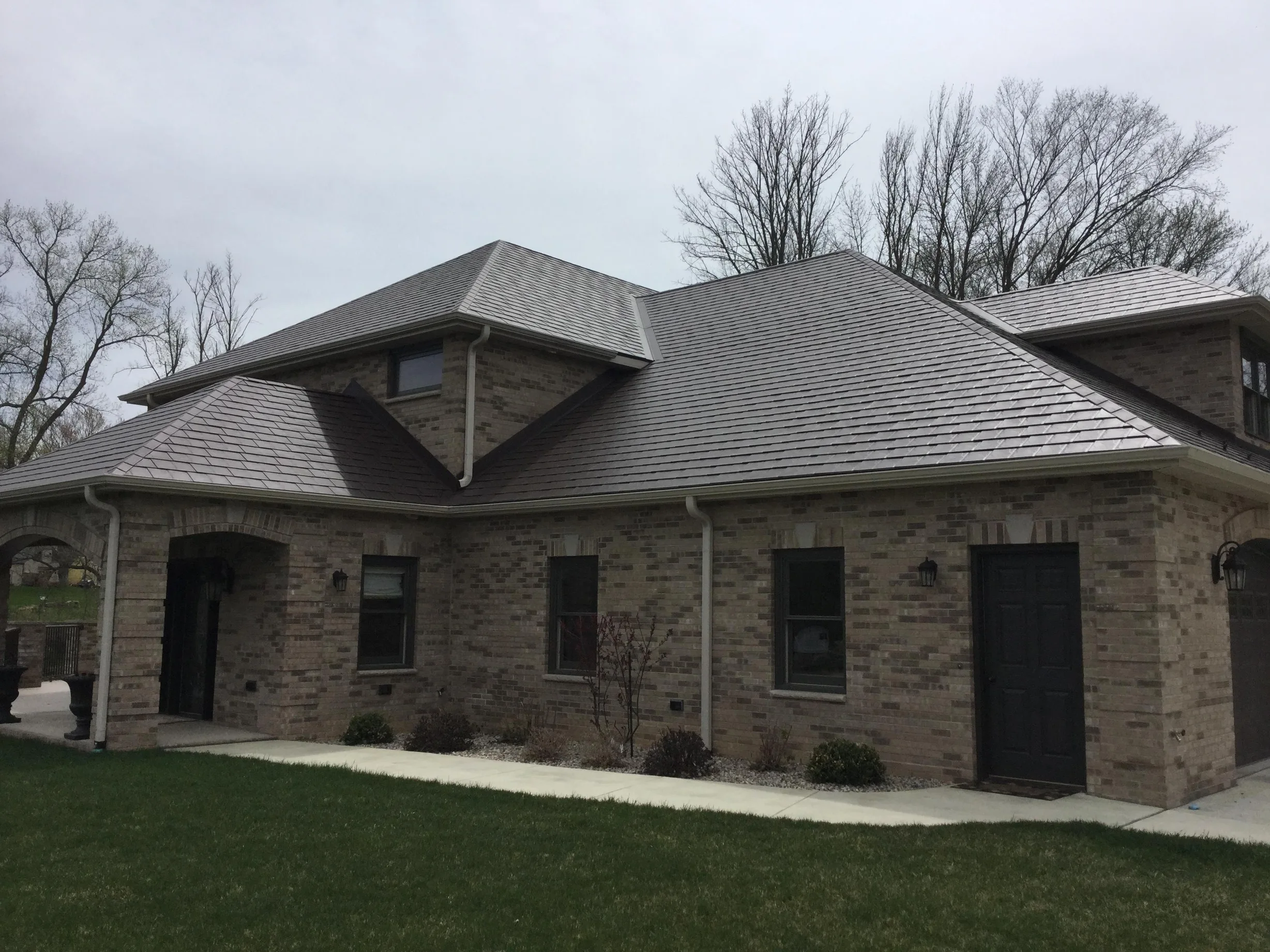 Colonial Brown Interlock Slate aluminum roof on a Colonial brown metal roof on a rural home, Horicon, Wisconsin