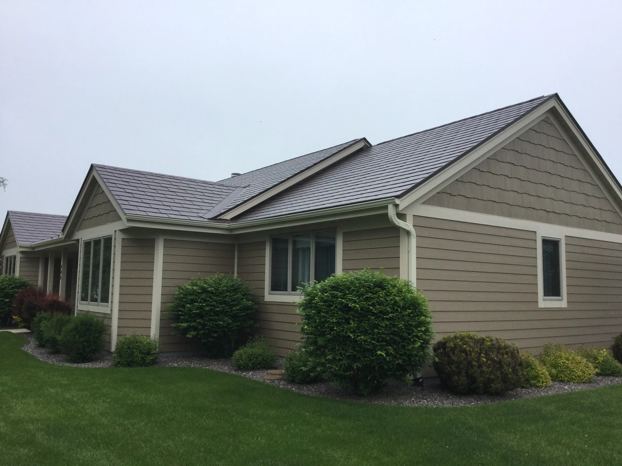 Colonial Brown Interlock Slate aluminum roof on a Colonial home with Colonial Brown metal roof on a rural, Port Washington, Wisconsin