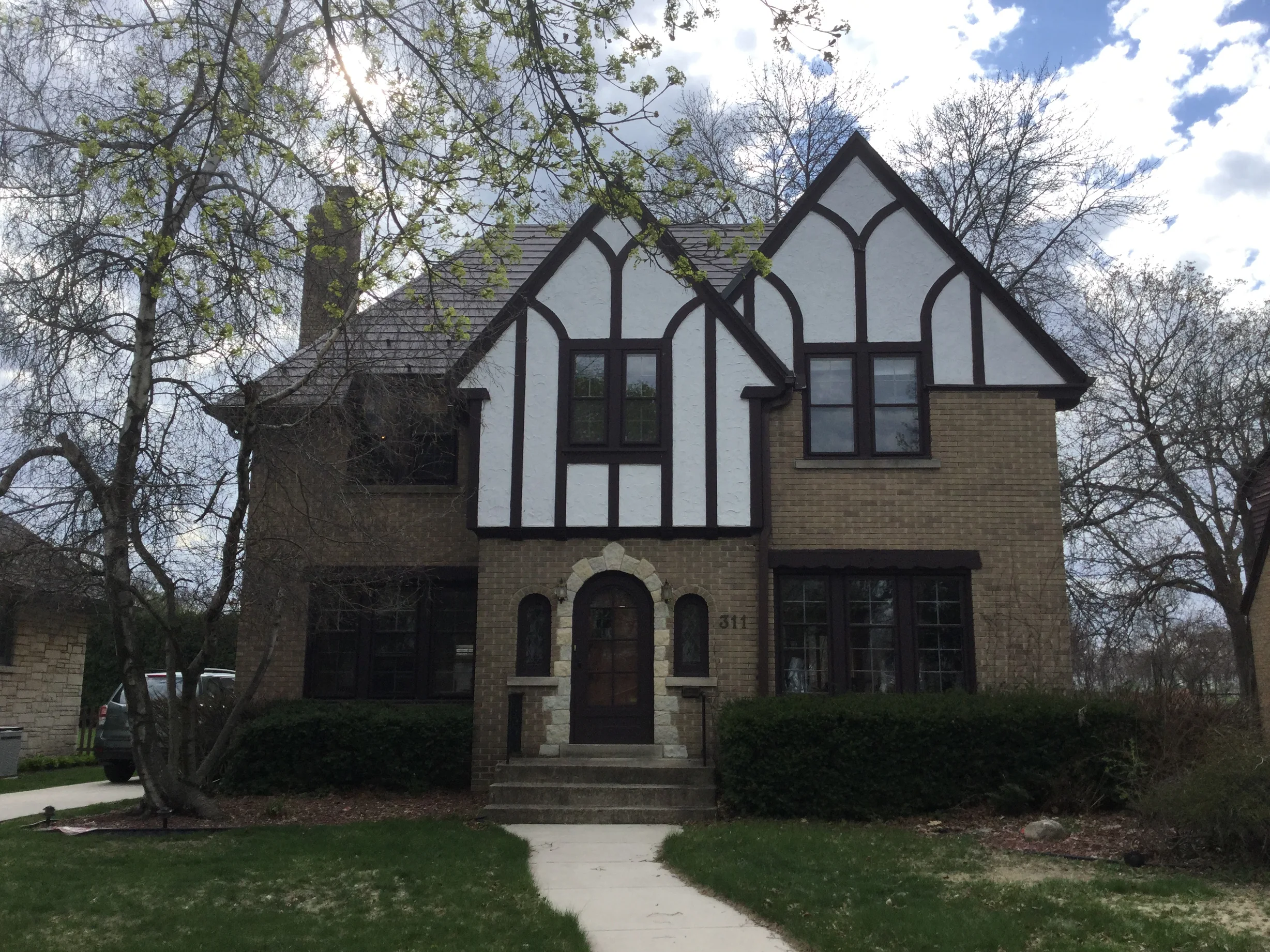 Colonial Brown Interlock Slate aluminum roof on a brown two-storey colonial home with dormers in a suburban, Milwaukee, Wisconsin