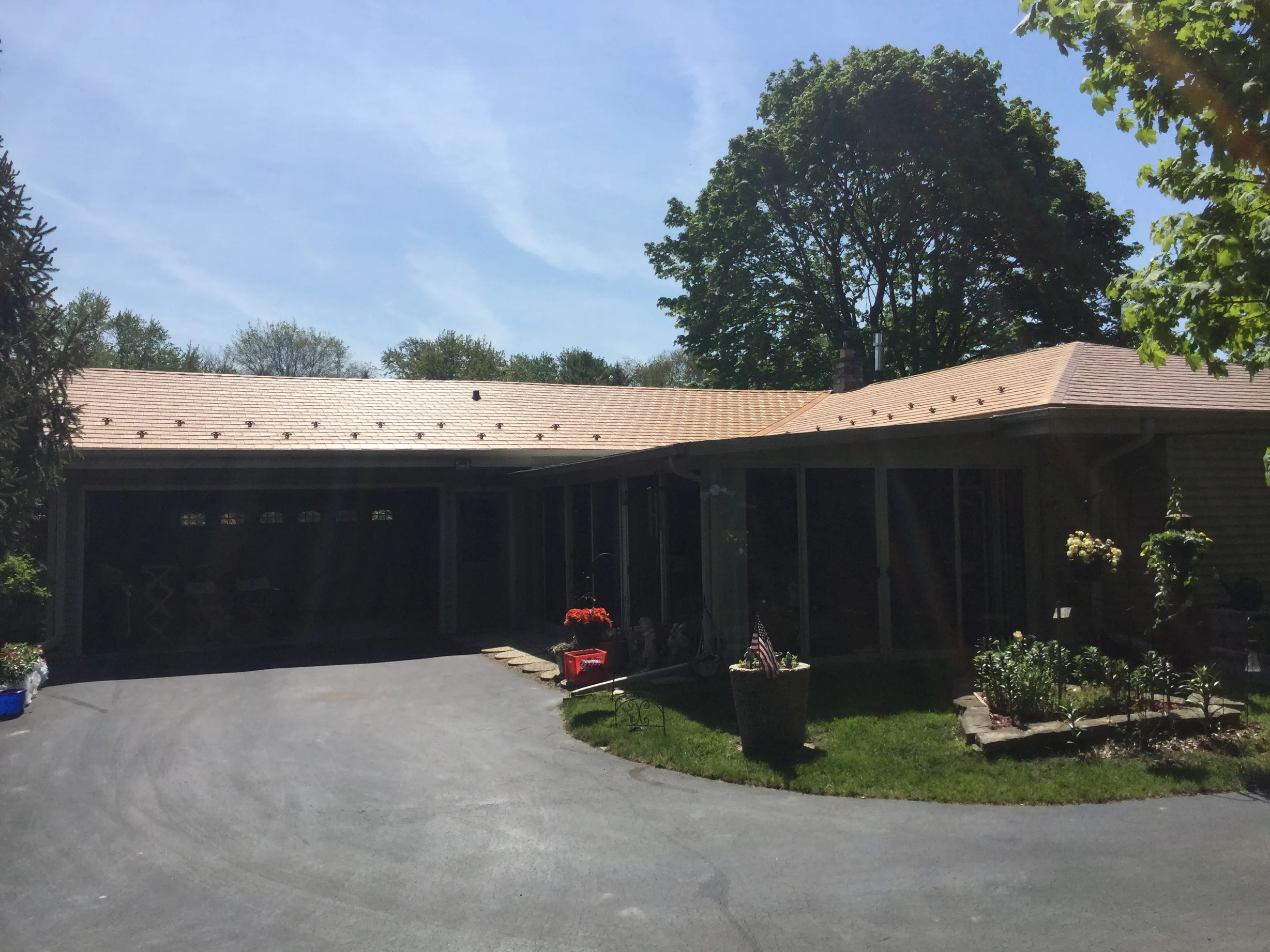 Aged Copper Interlock Slate aluminum roof on a ranch-style home with an Aged Copper metal roof in a, Colgate, Wisconsin